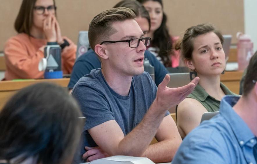 a student speaking in a classroom